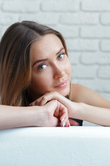 Beautiful business woman sits on sofa