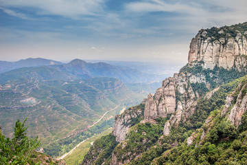 Fototapeta premium Montserrat green rocks near the Montserrat abbey, Catalonia