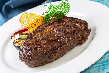 Beef steak on a wooden board