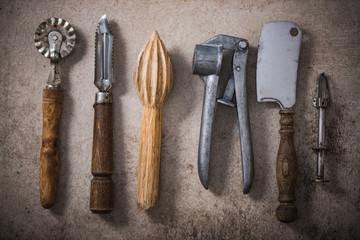 Vintage kitchen utensils on stone slate