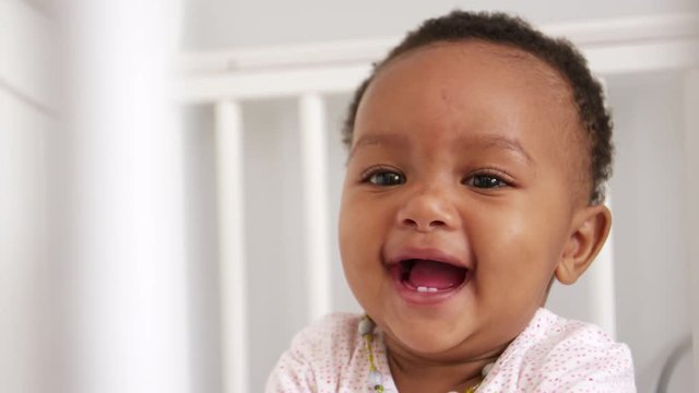 Happy Baby Girl Playing In Nursery Cot Shot In Slow Motion