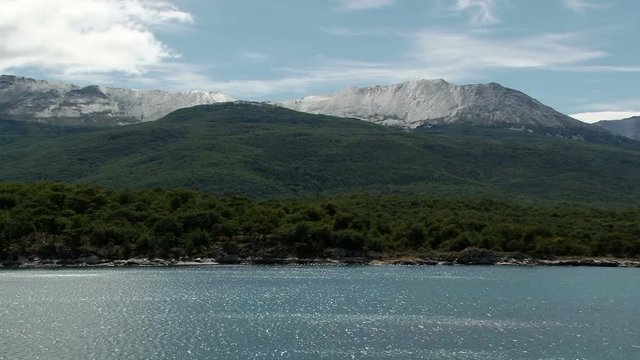 Snow mountains across bay Lapataia in Tierra del Fuego National Park, Argentina