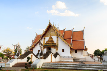 Fototapeta premium Wat Phra That Chang Kham , Muang District, Nan Province, Thailand. Temple is a public place.Created over 100 years old.