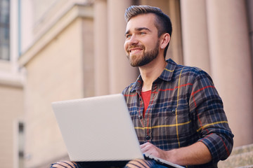 A man using a laptop.