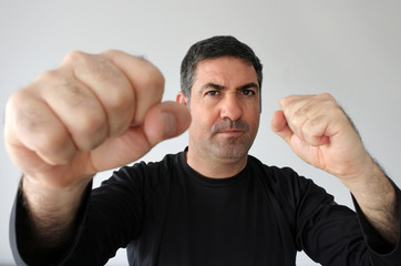 Aggressive man holds fists