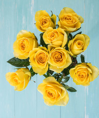 Yellow Roses Bouquet on wood background