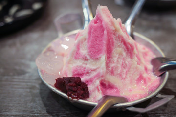 Sweet ice dessert in pink with milk for refreshment taste