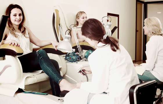 Female clients doing toenails