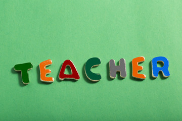 Word in Multiple Colors on Green Background TEACHER