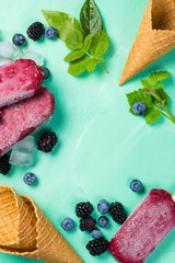 Berry ice cream on rustic wood background