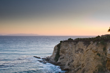 Fototapeta na wymiar Sunset rises above the rocky California coast