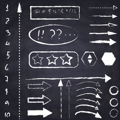 Set of hand drawn chalk arrows and symbols on the black chalkboard background.