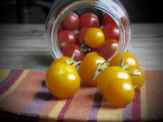 Cherry tomatoes background in a glass jar