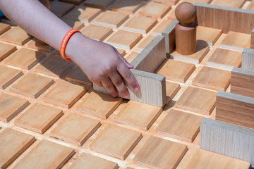  children play a traditional Turkish wooden puzzle game.