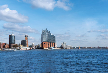 Fototapeta premium Hamburg harbor panorama with the river Elbe, Hafencity and the Elbphilharmonie opera house.