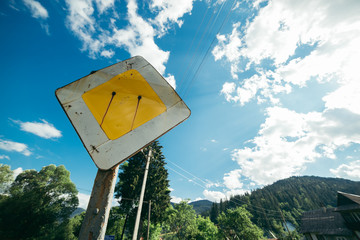 old rust main road sign
