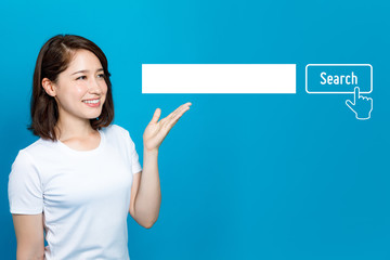 young woman pointing at the search bar.