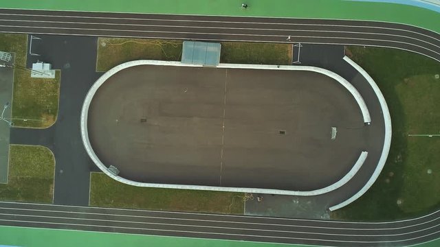 4K aerial drone footage. Fly over cycle track with riders top view
