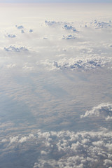 clouds and sun over the storm clouds, view from the top