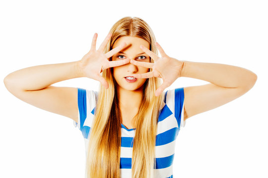 Woman covering her face with hands.