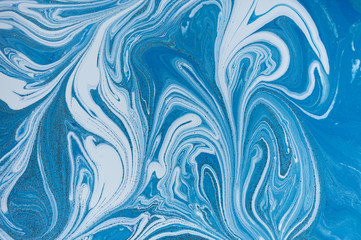 Marbled blue and golden abstract background. Liquid marble pattern