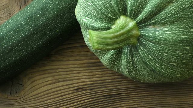 Zucchini (Cucurbita pepo) round zucchini (courgette) on wooden background
