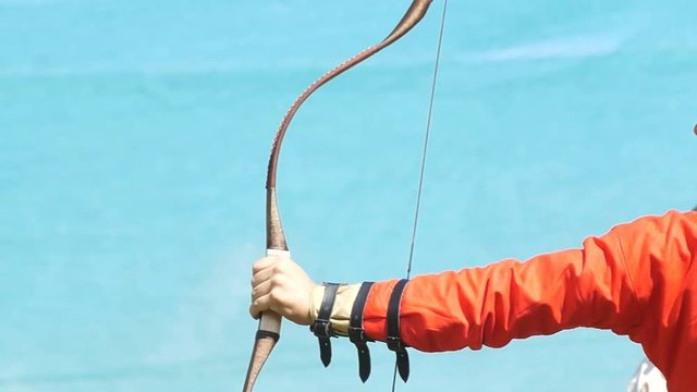 Archer shoots with an arrow