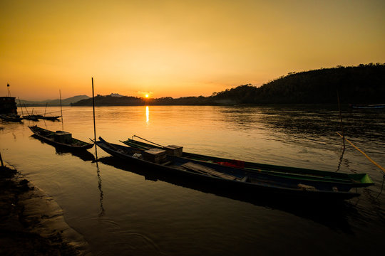 Tropical sunset above Mekong Laos