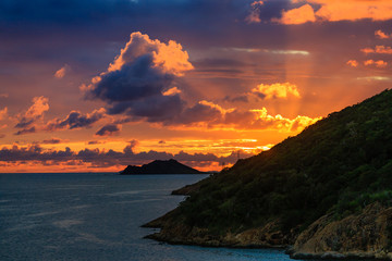 Dramatic Sunset Beyond Tropical Island