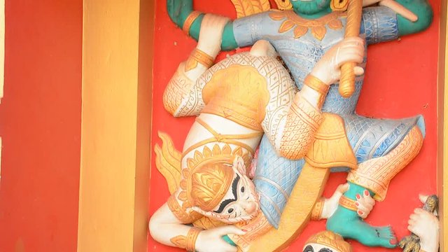 Art on the wall in That Luang, Laos