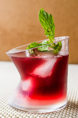 Malibu Sunset Cocktail with mint leaves..