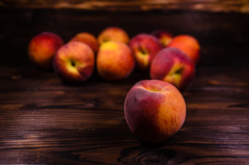 Fototapeta na wymiar Fresh ripe peaches on wooden table