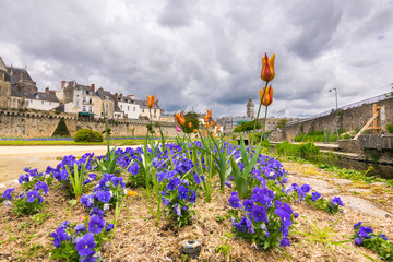 Walking on the narrow streets of Vannes in a gloomy day,  viewing Ramparts Garden, Gaillard Castle,...