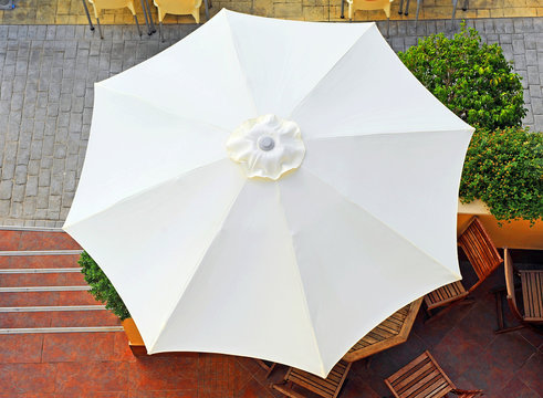White umbrella on the terrace
