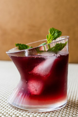 Malibu Sunset Cocktail with mint leaves..