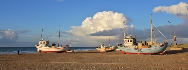 Summer afternoon at Slettestrand, Denmark. Fishing boats on the shore.