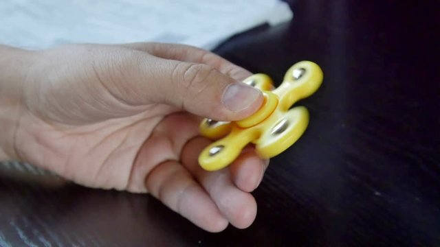 Man hand with rotating spinner. 4K UltraHD video footage