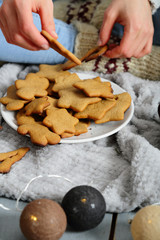 Female hands holding a Christmas cookie in hands