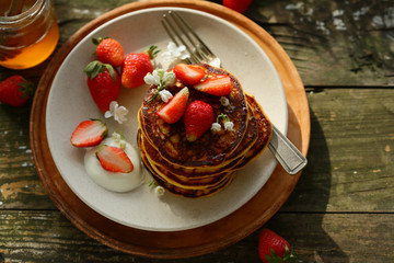 Breakfast pancake with cream and strawberry
