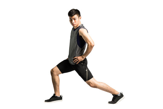 Portrait Of An Asian Sport Man Stretching His Bodies Before Exercise. Isolated Full Length On White Background With Copy Space And Clipping Path