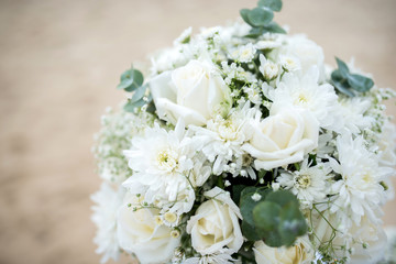 Soft focus Flowers decorate at a wedding ceremony on the beach.