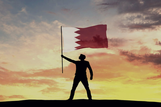 Male silhouette figure waving Bahrain flag. 3D Rendering