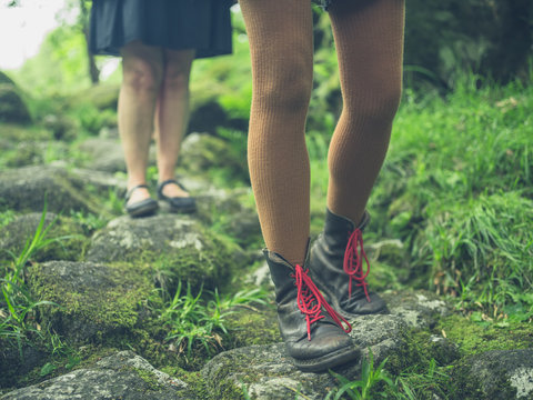 Two women walking in the forest