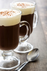 Irish coffee in glass on wooden table
