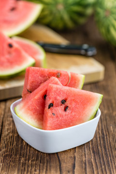 Portion of Fresh Watermelon on wooden background (selective focus).