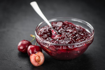 Cherry Jam on a vintage slate slab, selective focus