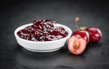 Cherry Jam on a vintage slate slab, selective focus