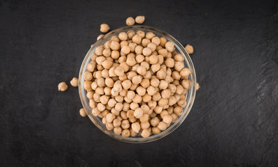 Chickpeas on a slate slab, selective focus