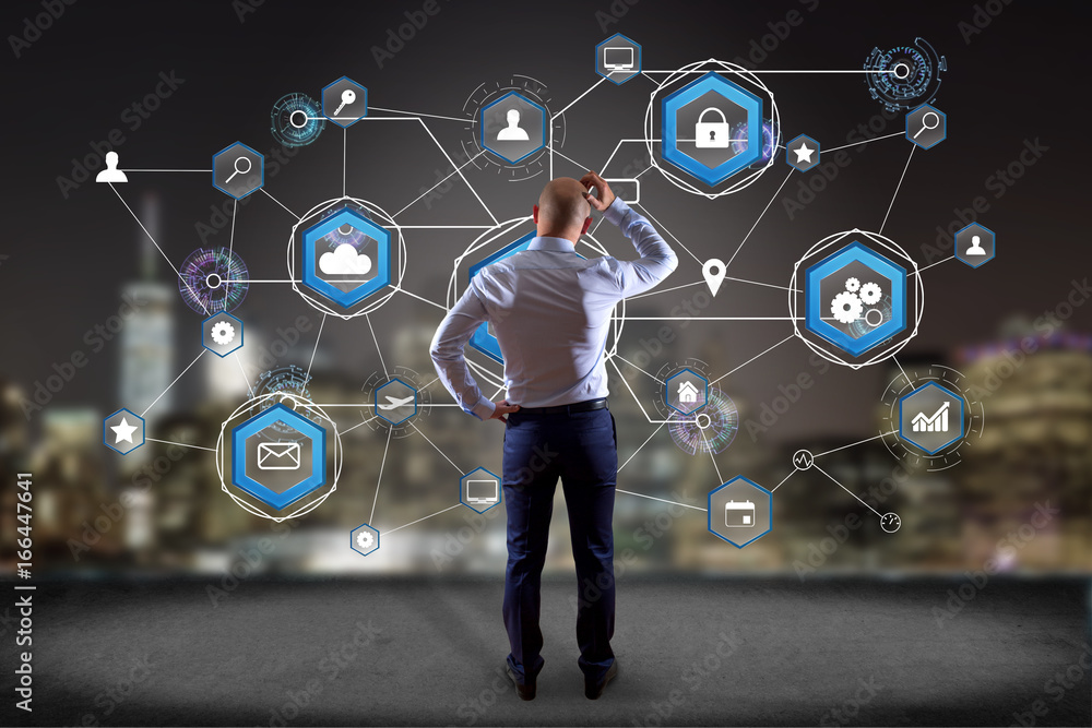 Poster businessman in front of a wall with an international business network connection displayed on a futu