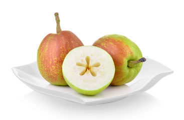 pear in ceramic plate (beautiful shape) on white background
